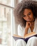 Pretty,African,American,Girl,With,Reading,A,Book,Sitting,On